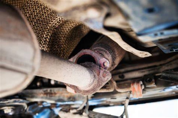 Can a car pass inspection with an exhaust leak?