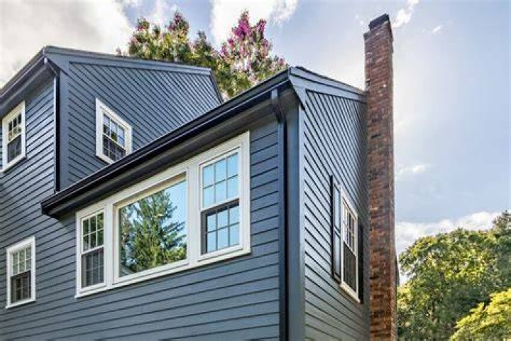 Can Hardie board be installed over stucco?