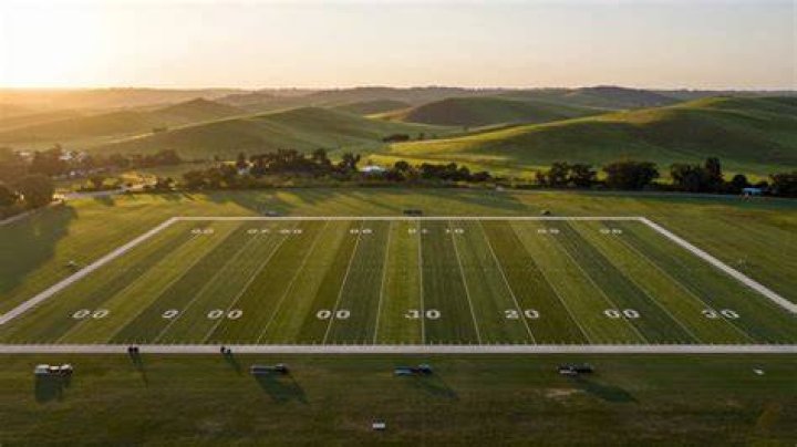How big is 80 acres in football fields?