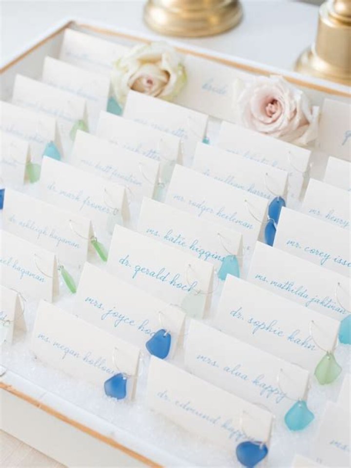 How do you arrange wedding escort cards?