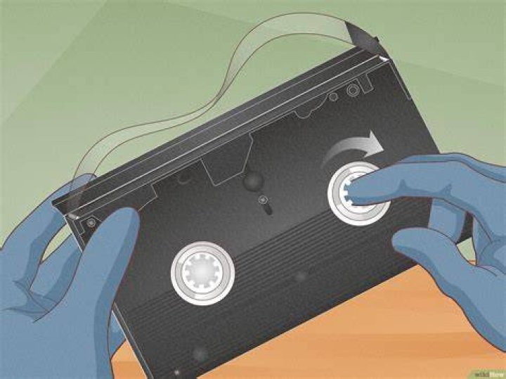 How do you manually rewind a VHS?