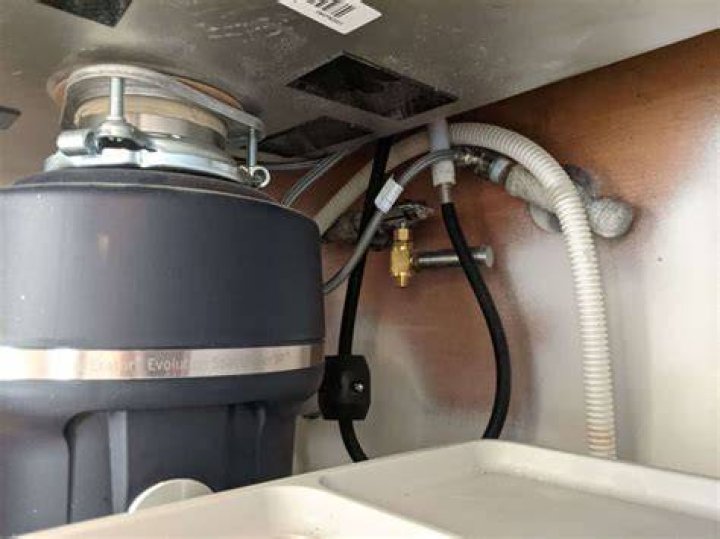 What can I use to clean my dishwasher drain?