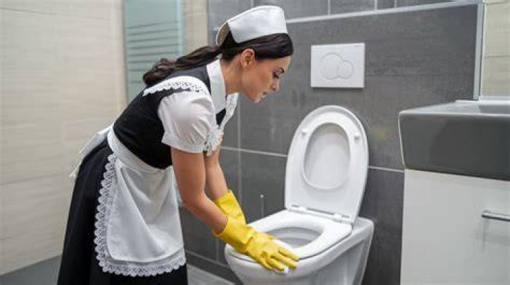 What causes black soot on toilet seat?
