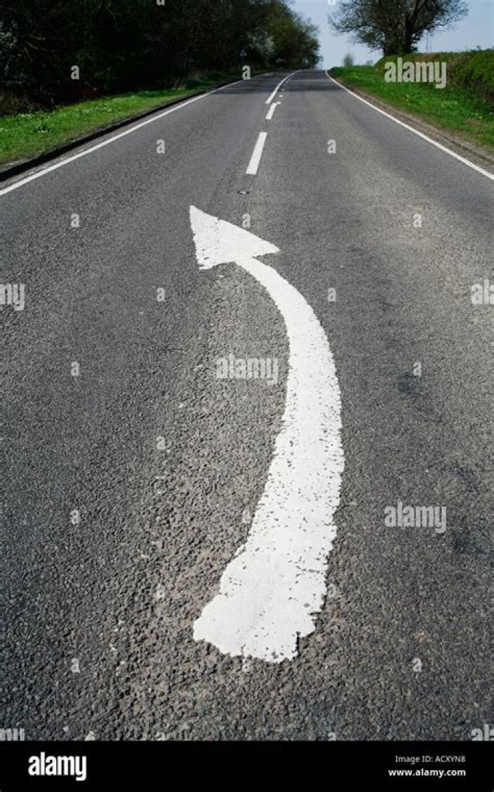 What do curved arrows on the road mean?
