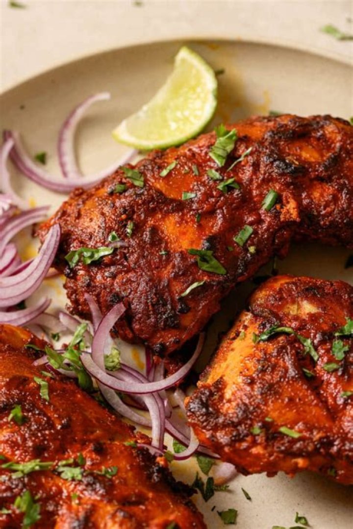 Where did tandoori chicken originated?