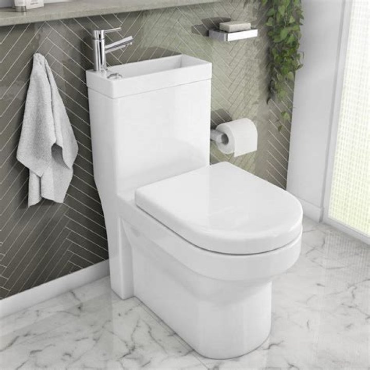 Where should a hand washing sink be located?