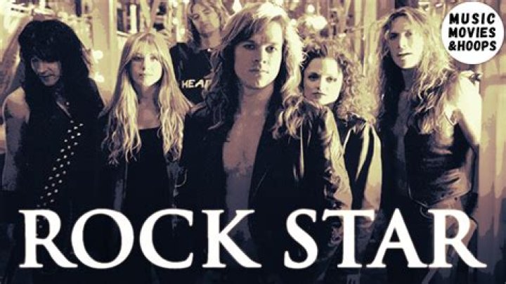 Who sings stand up and shout from the movie rock star?